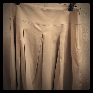 SKIRT matches gold top blouse listed in closet.